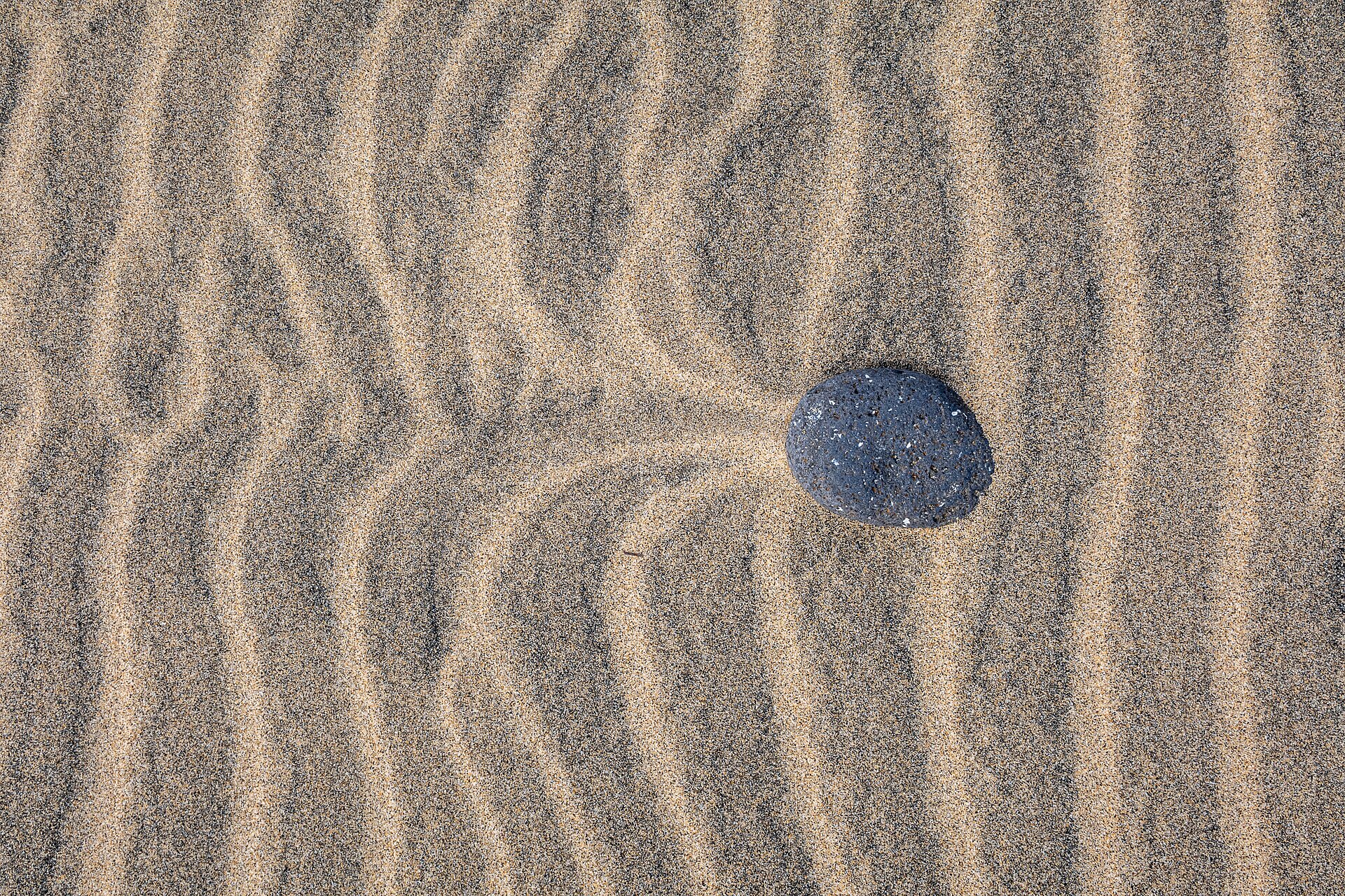 Structures with different colored sand on the beach of Morro Jable , Fuerteventura , Spain